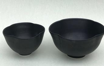 Two black bowls