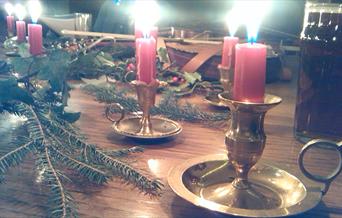 Christmas candles on table setting