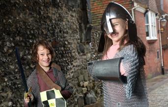 Children dressing up in armour