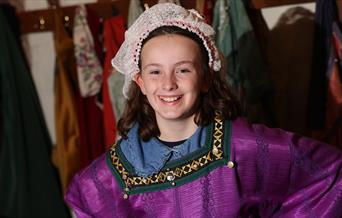Girl dressed in medieval outfit at Anne of Cleves House