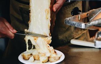 Raclette with gooey cheese