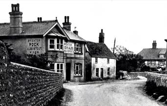 Black and white photograph of the centre of Piddinghoe