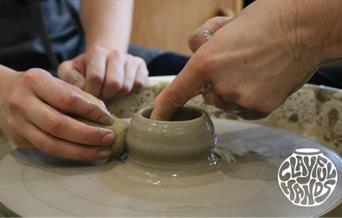 Using a pottery wheel