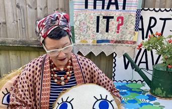 Local artist Samantha Stas with examples of her work for Artwave