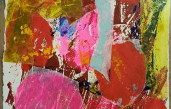 Abstract artwork in pinks, golds and reds