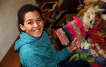 Boy enjoying Tudor Tuesday at Anne of Cleves House