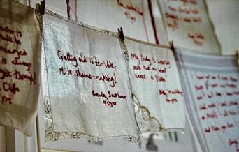 Embroidered handkerchiefs with messages from the elderly