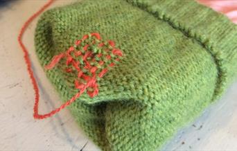 Visible darning in progress