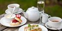 Afternoon tea served with a glass of fizz