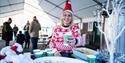 Member of staff at Plumpton Racecourse in Christmas jumper