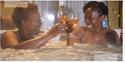 2 women drinking in wine in a hot tub!