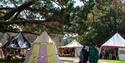 medieval tents with people in costume