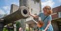 Family looking at a cannon in Lewes Gun Garden