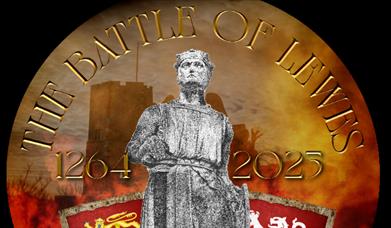 Statue with shields standing against a silhouette of Lewes Castle