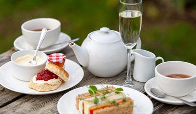 Afternoon tea served with a glass of fizz