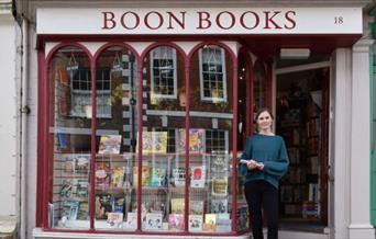 Boon Books shopkeeper in doorway