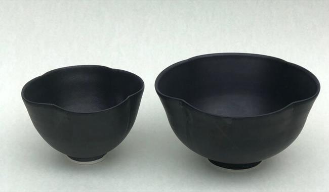 Two black bowls