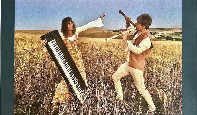 Musicians Piers Adams and Lyndy Mayle in a cornfield