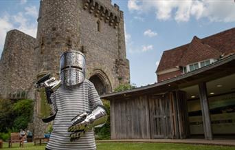 Child wearing armour at Lewes Castle.