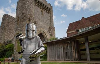 Young person dressed in armour at Lewes Castle