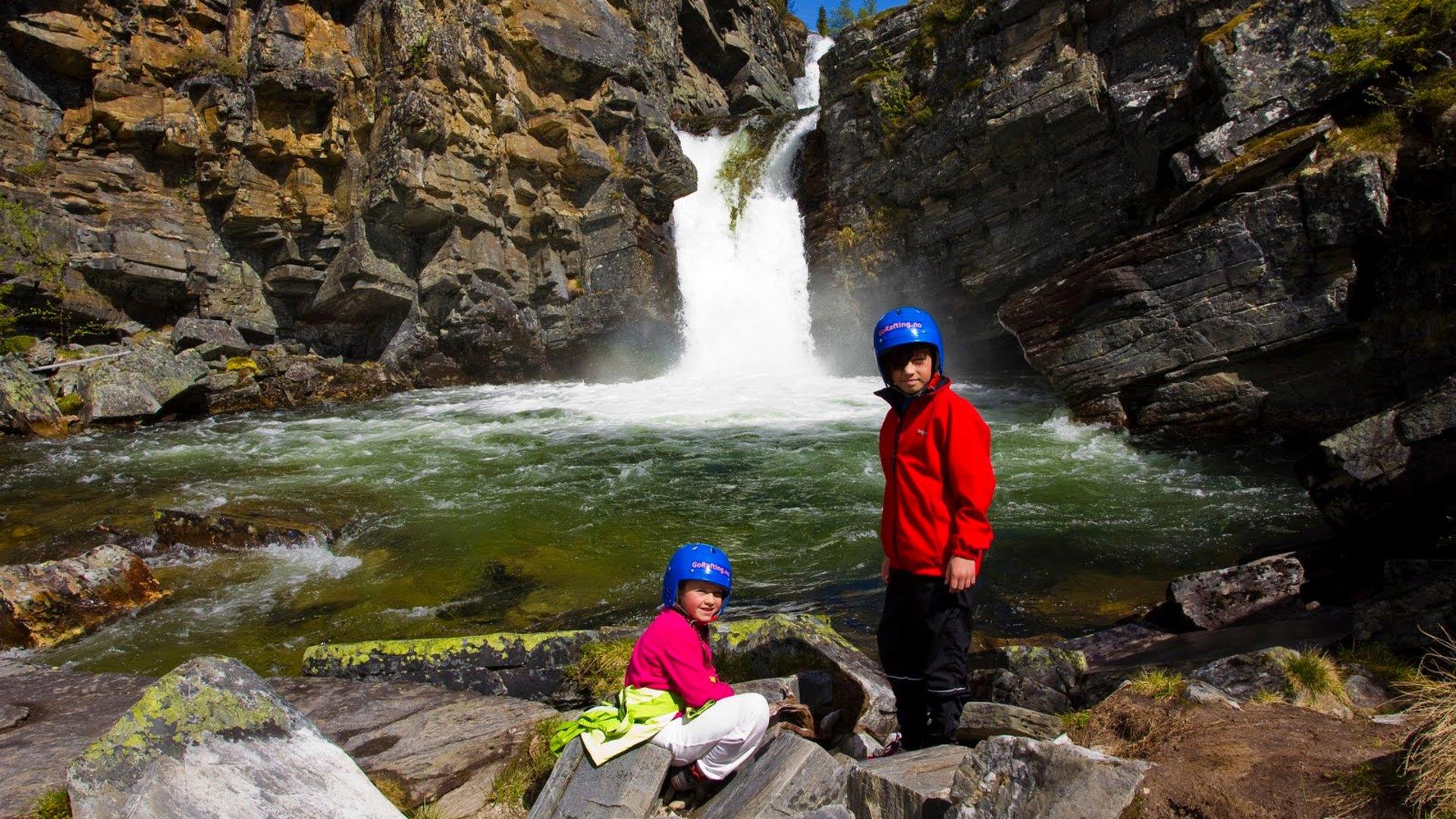 Taking a break in front of waterfall