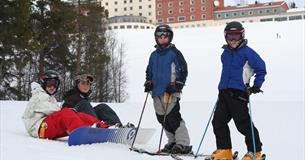 Happy children alpine skiing at Dalseter