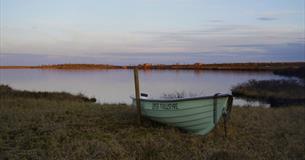 Smal boat by a mountain lake