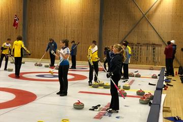 Several teams playing curling