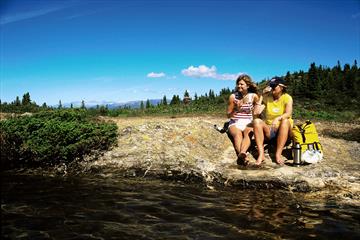 2 persons enjoying the nice weather  at the lake shore