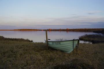 Smal boat by a mountain lake