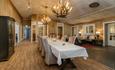 Long dinner table in one of the dining rooms at Hafjell hotel