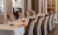 Long dinner table in one of the pretty dining rooms at Hafjell hotel / Hafjell Ressort