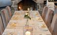 Table set and ready for guests in front of the fireplace at Hafjell ressort / Hafjell Hotell