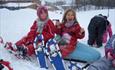 Girls with snowshoes taking a break