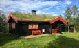 Malmbu, a traditional turf-roofed cabin. Venabu Hytter