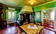 Kitchen at Sygaard Grytting with a fireplace in the corner