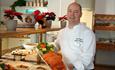 The chef shows off some dishes from the buffet table at Thon Hotel Skeikampen Restaurant