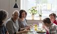 Family enjoy their dinner at Stasjonen Cafe & Restaurant