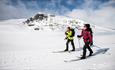 2 ladies crosscountry skiing in the mountain