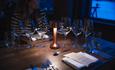 Table setting with candlelight in a restaurant.