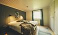 Bright and comfortable bedroom in the farmhouse.