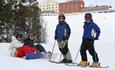 Happy children alpine skiing at Dalseter