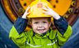 Happy boy with a yellow helmet