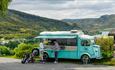 Food truck overlooking the golf course and mountains.
