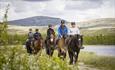 A group of horses and riders on Venabygdsfjellet