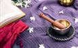 A singing bowl and flower petals