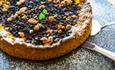 A fresh blueberry cake on a slate at Venabu Fjellhotell