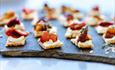 Canapés ready on a slate