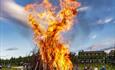 People gather by a bonfire at Venabu