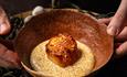 Refined dish with a creamy base and garnish.